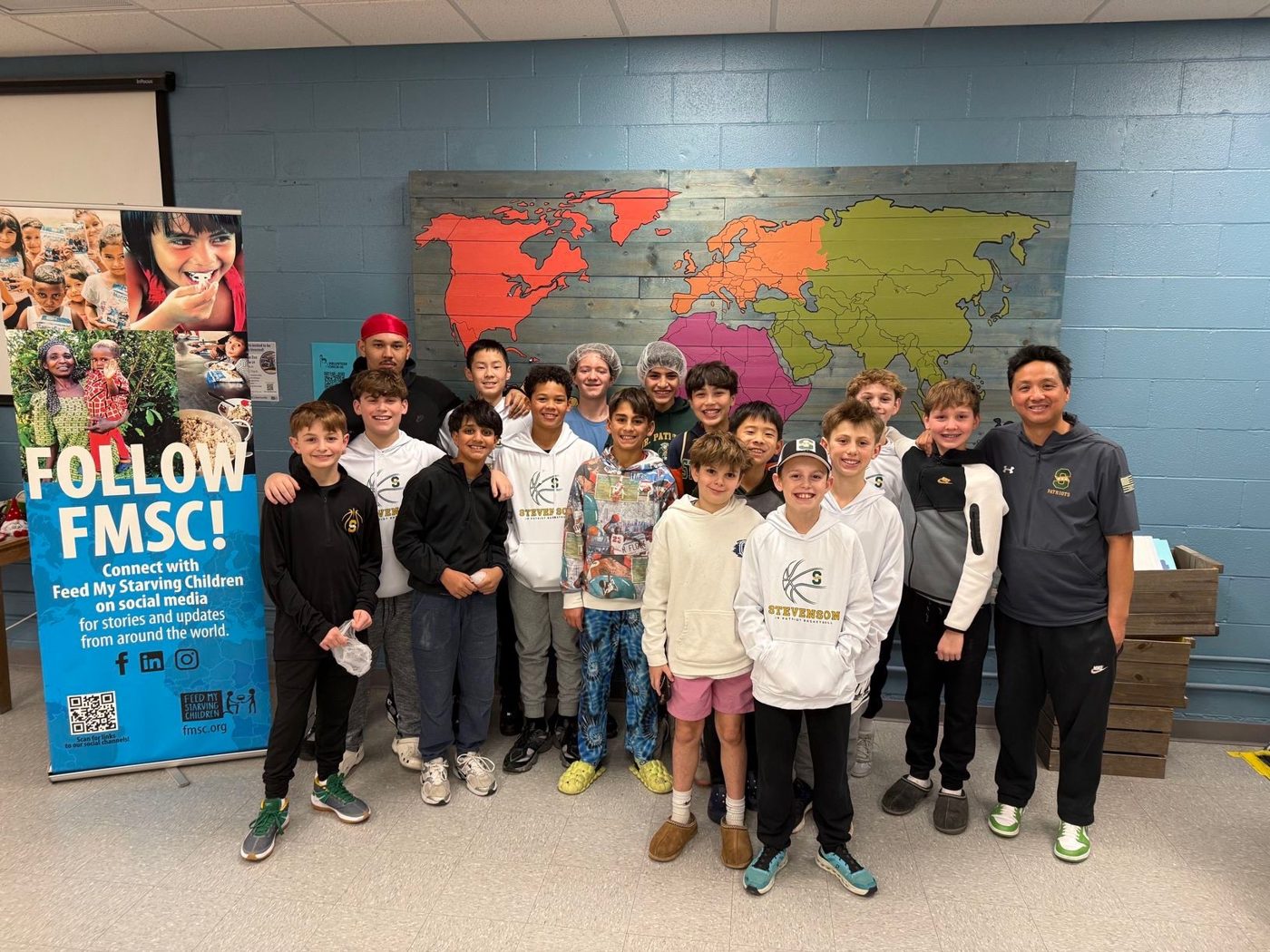 OG Elite players volunteering at Feed My Starving Children